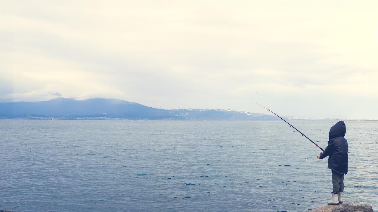 A child fishing in Sapanca Lake, the famous lake in eastern Marmara region, Sakarya, Türkiye. (Adobe Stock Photo)